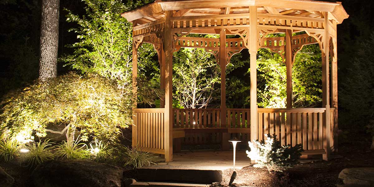 wooden-gazebo-lit-up-at-night