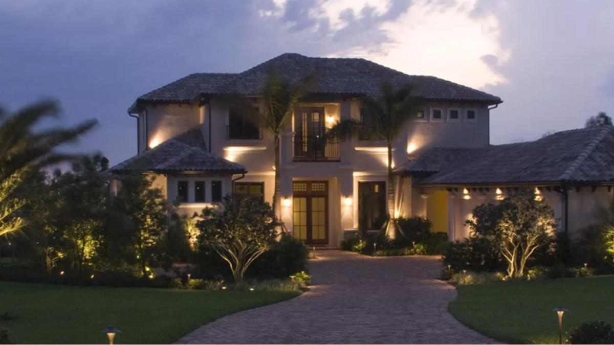 front-yard-with-lamps-at-driveway-in-dusk
