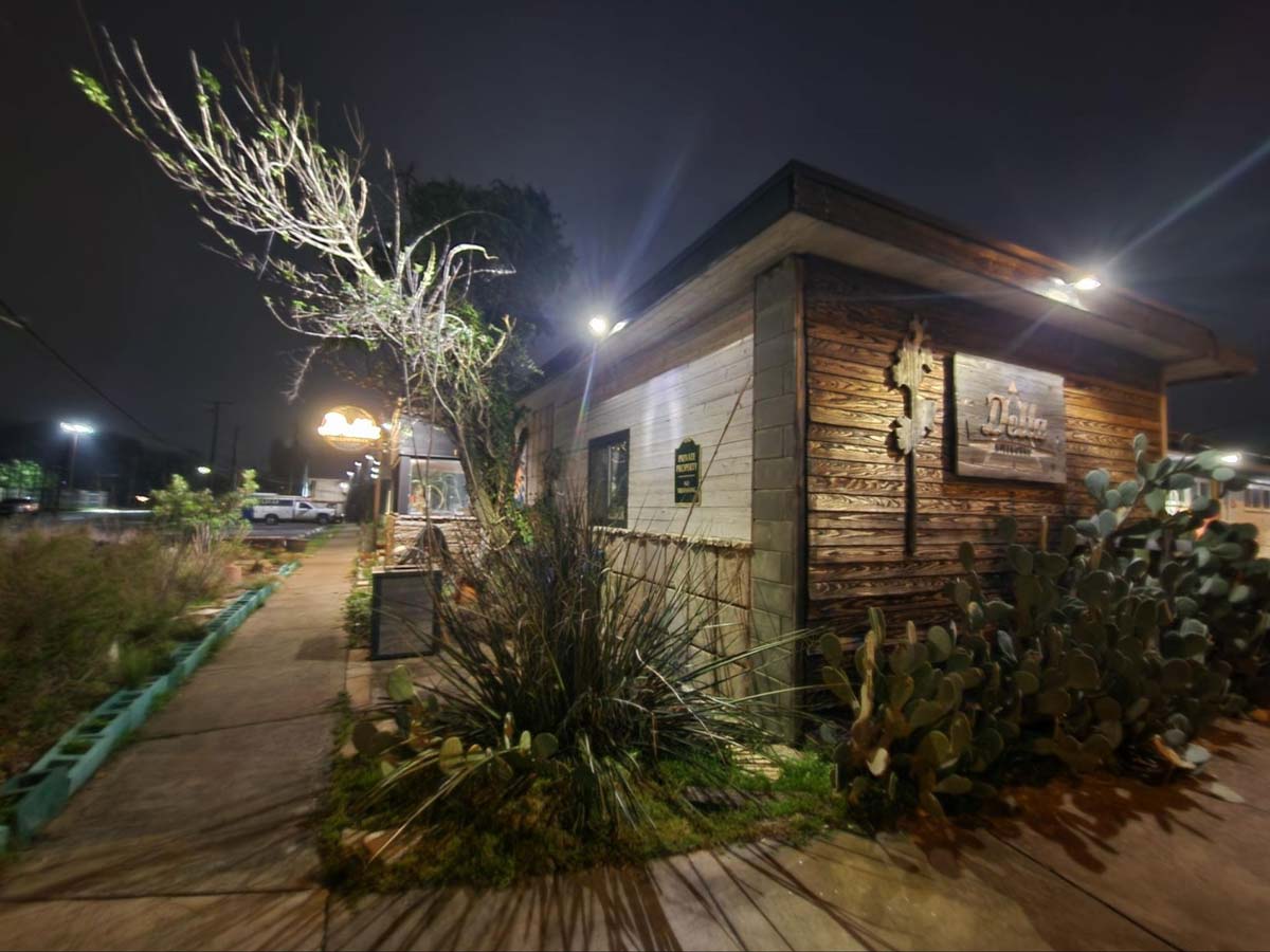 wooden-restaurant-with-trees-and-outdoor-lighting-at-night
