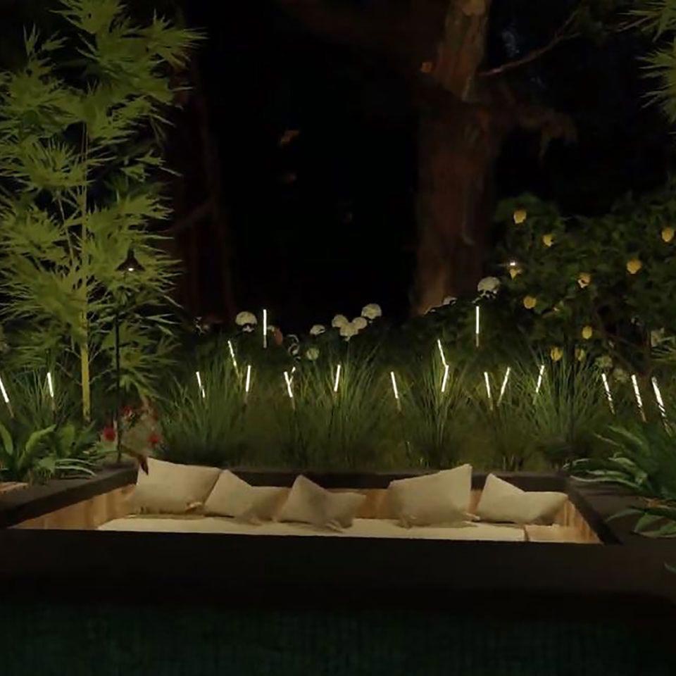 Bamboo lights arrainged behind an outdoor couch